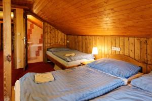 Postel nebo postele na pokoji v ubytování Penzion Kapitanka