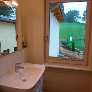 a bathroom with a sink and a window at Wilsterberg in Ascheffel