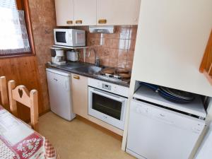 a small kitchen with a sink and a stove at Studio Valloire, 1 pièce, 4 personnes - FR-1-263-6 in Valloire