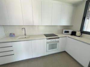 Kuchyň nebo kuchyňský kout v ubytování Flat Infinium 15th Floor