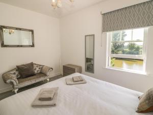 Ένα ή περισσότερα κρεβάτια σε δωμάτιο στο Florence Villas