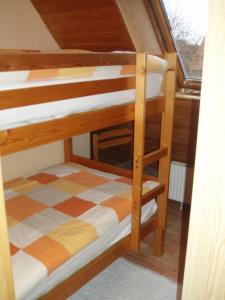 a couple of bunk beds in a room at Ferienhaus Astrid in Osteel