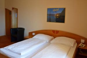 Postel nebo postele na pokoji v ubytování Hotel Restaurant Marko