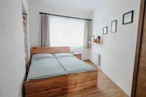 Postel nebo postele na pokoji v ubytování Apartmán Ve Dvoře Strážnice