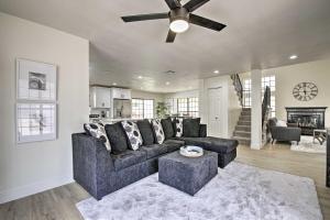 a living room with a couch and a ceiling fan at Glendale Family Home Close to Golf and Westgate in Glendale