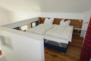 Ein Bett oder Betten in einem Zimmer der Unterkunft M Lau 1
