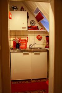 a small kitchen with a sink and a counter at Voß, FW in Zingst