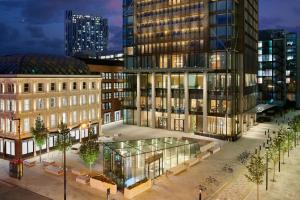a rendering of a building in a city at night at Pan Pacific London in London