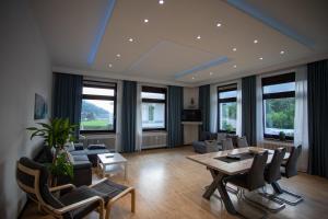 a living room with a table and chairs at Ferienwohnung Höpperger in Schönberg im Stubaital