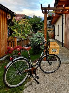 a bike parked in front of a house at Tonis Apartment in Bad Goisern