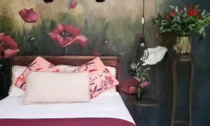 Postel nebo postele na pokoji v ubytování Niños Hotel Fierro