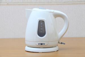 a white tea kettle sitting on top of a table at Sendai Business Hotel Ekimae - Vacation STAY 71907v in Sendai