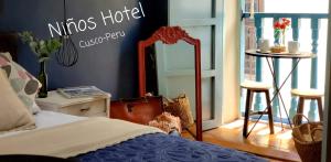 Postel nebo postele na pokoji v ubytování Niños Hotel Fierro