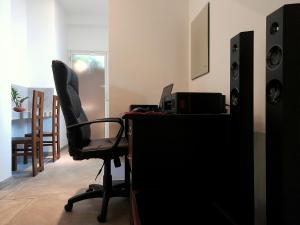 an office with a desk with a computer and a chair at Weligama Bay Watsila Resort in Weligama