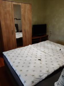 Кровать или кровати в номере Ferienwohnung Katzschner