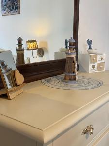 a dressing table with a mirror and a lamp on it at GIARDINO SUL MARE in Amalfi