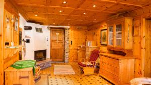 a kitchen with wooden cabinets and a fireplace at Landvilla Theresien-Gut, 20 - 25 Personen in Marktoberdorf