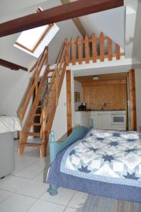 a bedroom with a bunk bed and a staircase at Ferienhof Frohne - Kornspeicher in Merzen