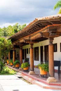 a group of potted plants inront of a building at Hostería San Felipe in Pátzcuaro