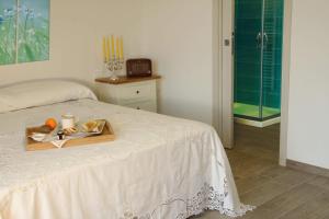 Ένα ή περισσότερα κρεβάτια σε δωμάτιο στο Agriturismo Albero del Miele +38 φωτογραφίες