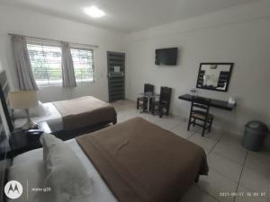 Postel nebo postele na pokoji v ubytování Hotel & Suites Mo Sak + 37 fotografií