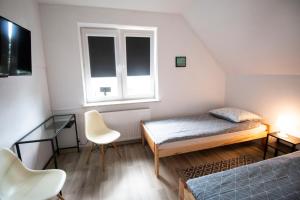 Posteľ alebo postele v izbe v ubytovaní Dom na Spokojnej + 20 fotografií