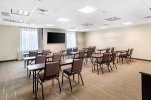 a conference room with tables and chairs and a screen at Sleep Inn Lancaster Dallas South in Lancaster +46 photos