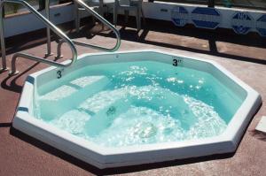 a jacuzzi tub with blue water in it at Laguna Surf in Laguna Beach