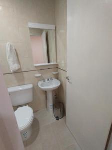 a bathroom with a toilet and a sink at Habitación con baño privado en edificio 1er piso in San Salvador de Jujuy +25 photos