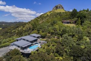 an aerial view of a house on a hill at King's View Lodge in Whangaroa