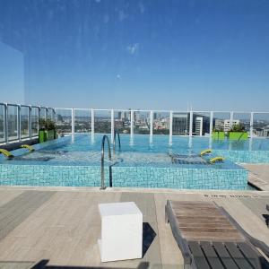 a swimming pool on the roof of a building at Latitude Med Center in Houston