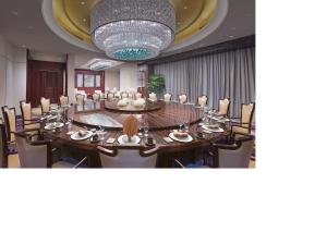 Restoran või mõni muu söögikoht majutusasutuses Wanda Vista Tianjin