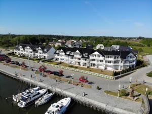 a group of boats docked at a marina at Hafenkiek 39 in Ostseebad Karlshagen