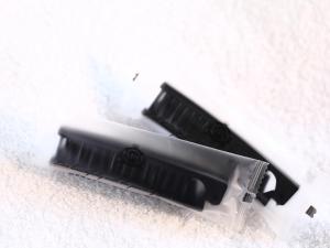 two black toothbrushes sitting on a white surface at APA Hotel Nambaminami Daikokucho Ekimae in Osaka