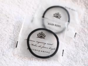 a pair of hoop earrings sitting on a piece of paper at APA Hotel Nambaminami Daikokucho Ekimae in Osaka