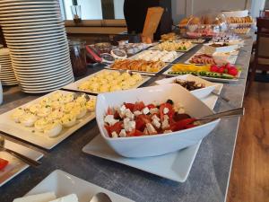 a buffet with many different types of food on a table at Villa Roma przy wyciągu na Szrenicę in Szklarska Poręba