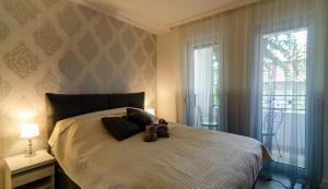 Una cama o camas en una habitación de Apartman MDB LUX