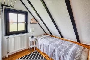 سرير أو أسرّة في غرفة في Ferienhaus Hygge