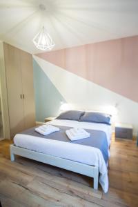 A bed or beds in a room at CASA STELLA San Sisto