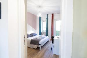 A bed or beds in a room at CASA STELLA San Sisto