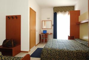 Posteľ alebo postele v izbe v ubytovaní Hotel Lido