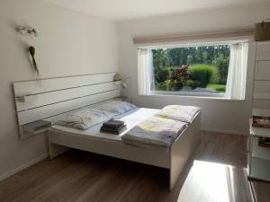 Postel nebo postele na pokoji v ubytování Studiový apartmán V Zahradě
