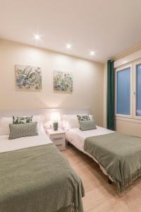 Posteľ alebo postele v izbe v ubytovaní Apartamentos Bellas Artes