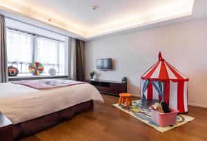 Postel nebo postele na pokoji v ubytování Starr Hotel Shanghai (Shanghai Railway Station)