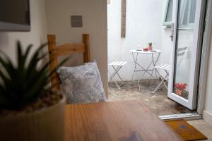 a pillow sitting on a table in a room at Sennen Cove Retreat in Sennen Cove