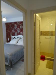 a bedroom with a bed and a sliding glass door at Carla's Apart Palas-Hala Centrala 1 Bedroom - shuttle in Iaşi +43 photos
