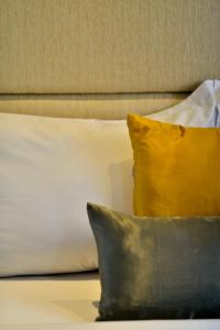Postel nebo postele na pokoji v ubytování Serela Waringin by KAGUM Hotels