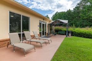 a patio with chairs and a gazebo at Comfort Suites in Milledgeville