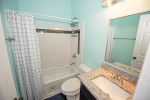 a bathroom with a tub and a toilet and a sink at Campbellton rd APT A in Atlanta