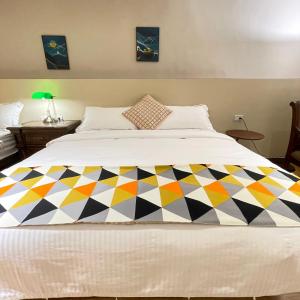 Postel nebo postele na pokoji v ubytování 墾丁聚點旅棧 2Ps Hotel